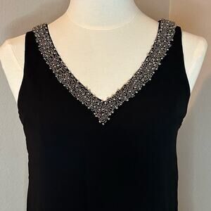 XOXO women’s black top with sheer lower back and sides, size XS